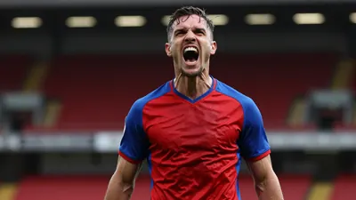 Mid-30s forward, muscular, waist-up, drenched in sweat, eyes blazing, mouth open in a triumphant shout, wearing an...